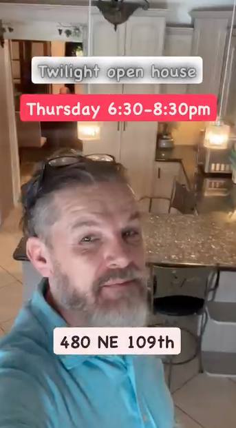 Pip in the kitchen before a twilight open house at 480 NE 109th Street